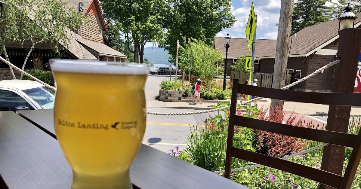 closeup of Bolton Landing Brewery beer glass on patio