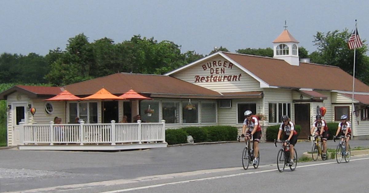 cyclists riding past the burger den