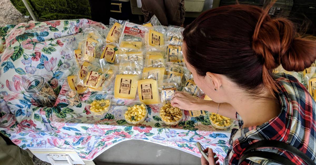 woman sampling cheese
