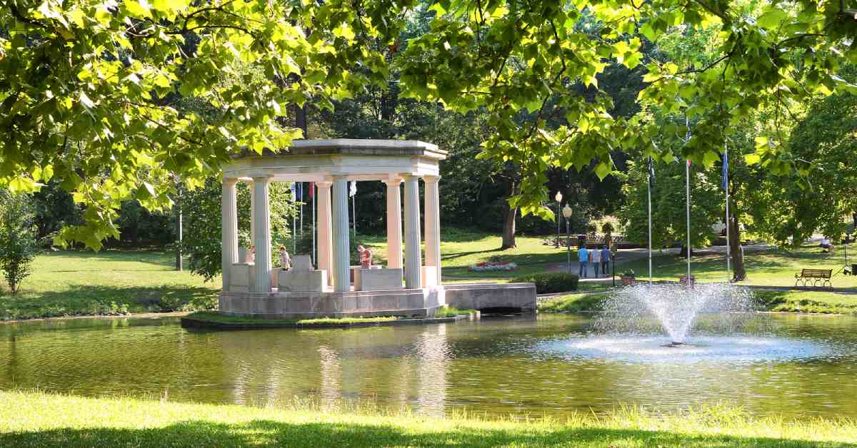a gazebo in the middle of a pond in congress park