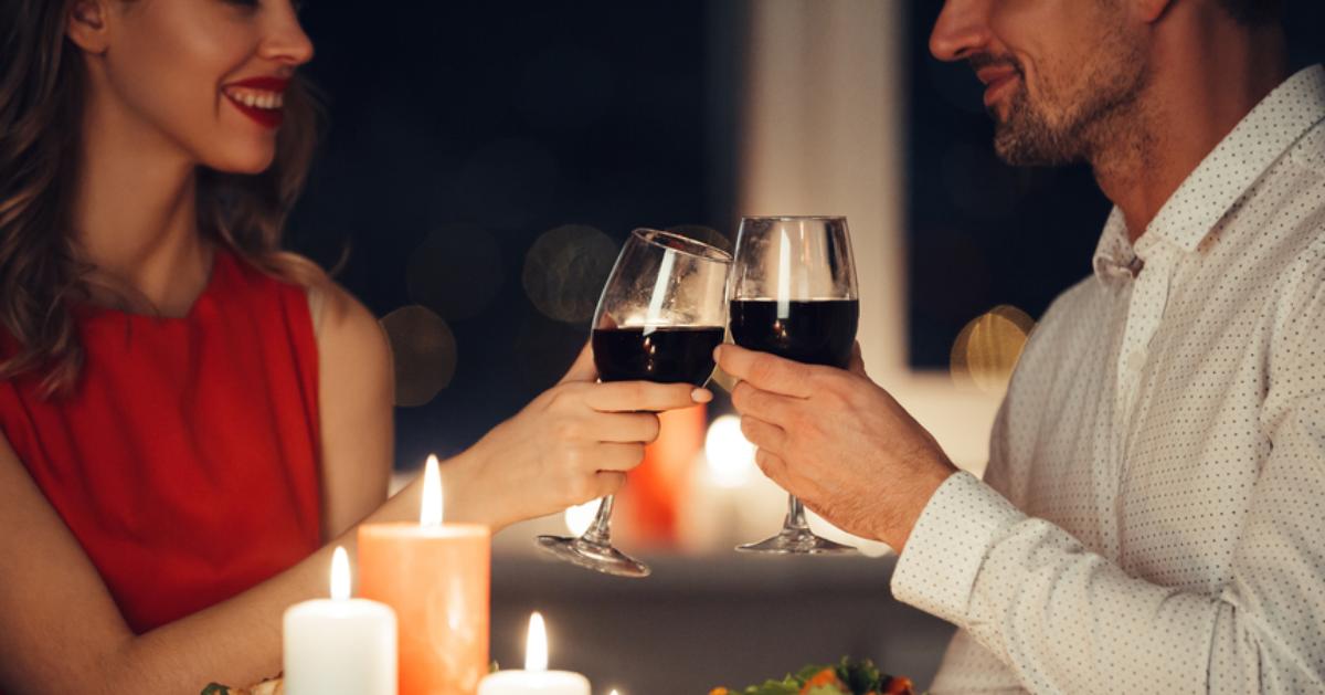 man and woman at dinner with wine