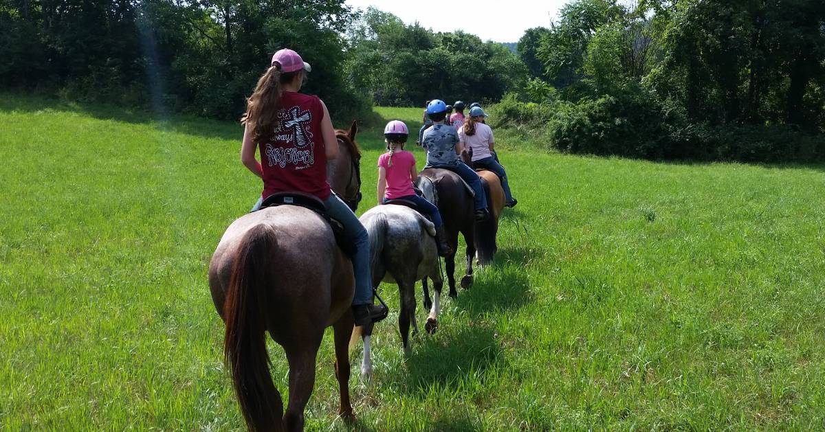 group of people horseback riding