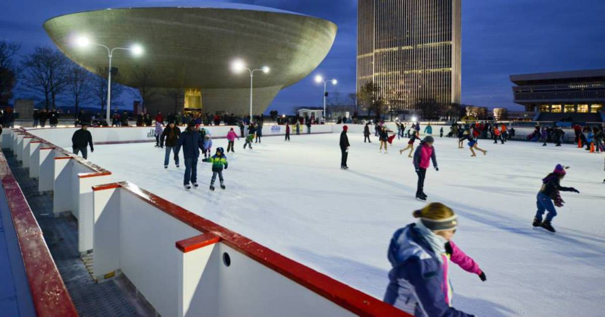 people ice skating in the evening