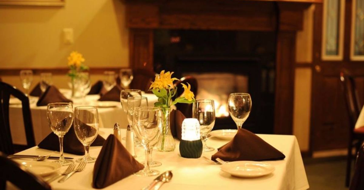 dining tables near fireplaces in a restaurant
