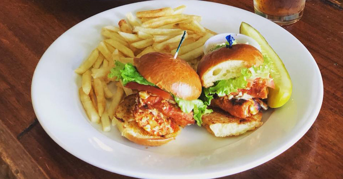 chicken sandwich on a plate with fries