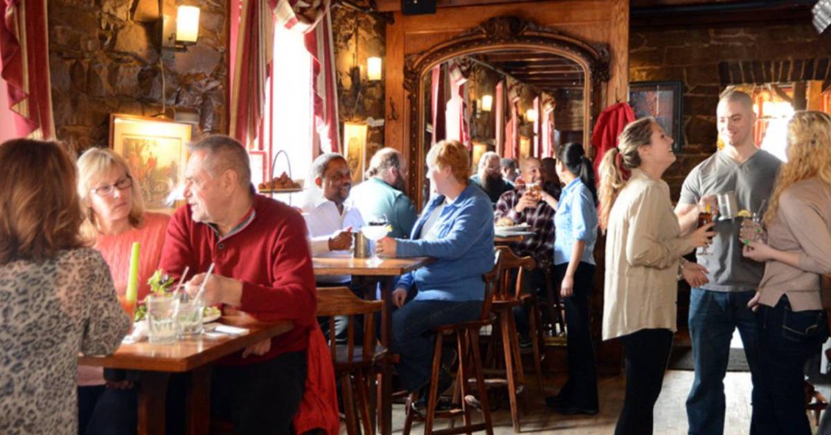 people eating at tables in a restaurant