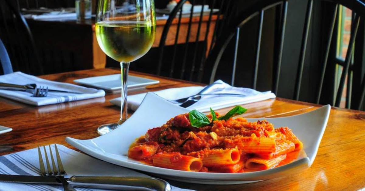 pasta dinner with wine on table