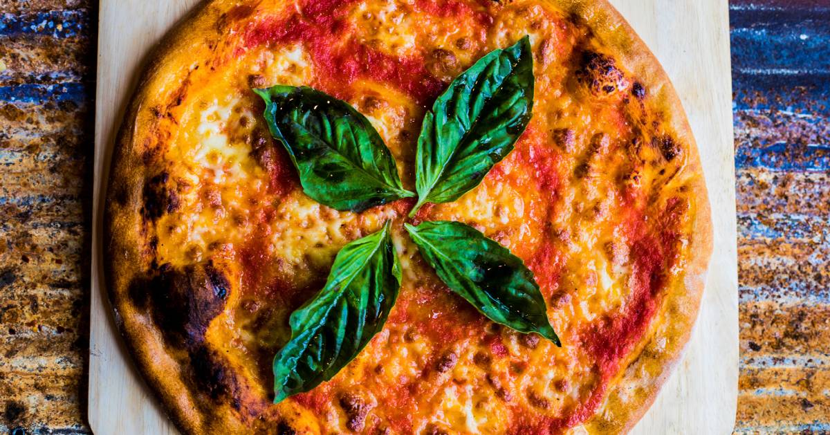 pizza with basil leaves