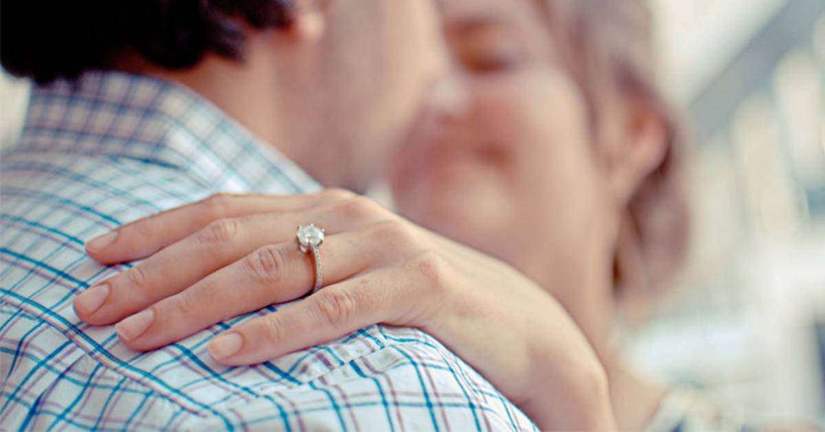 man and woman hugging