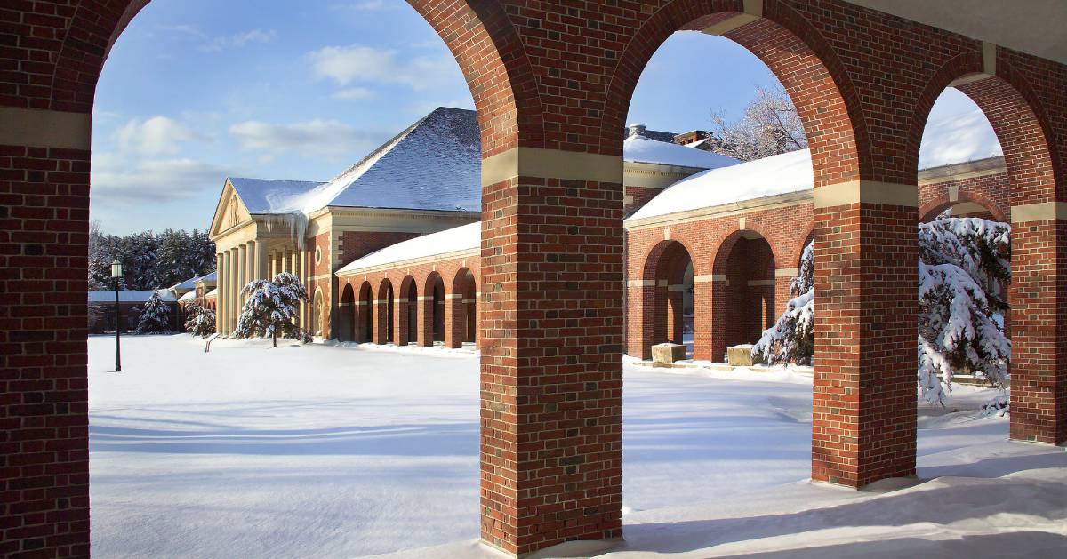 view of brick buildings and snowy ground