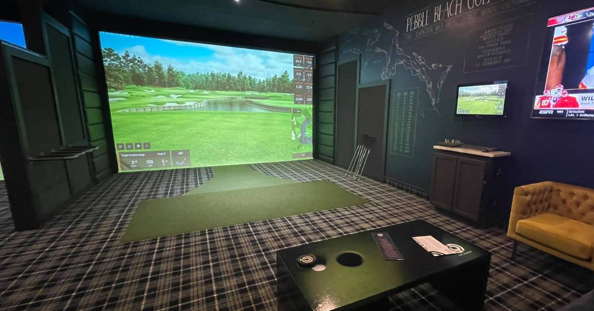 seating area and a virtual golf simulator screen
