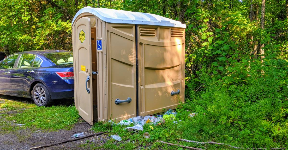 trash by porta potty