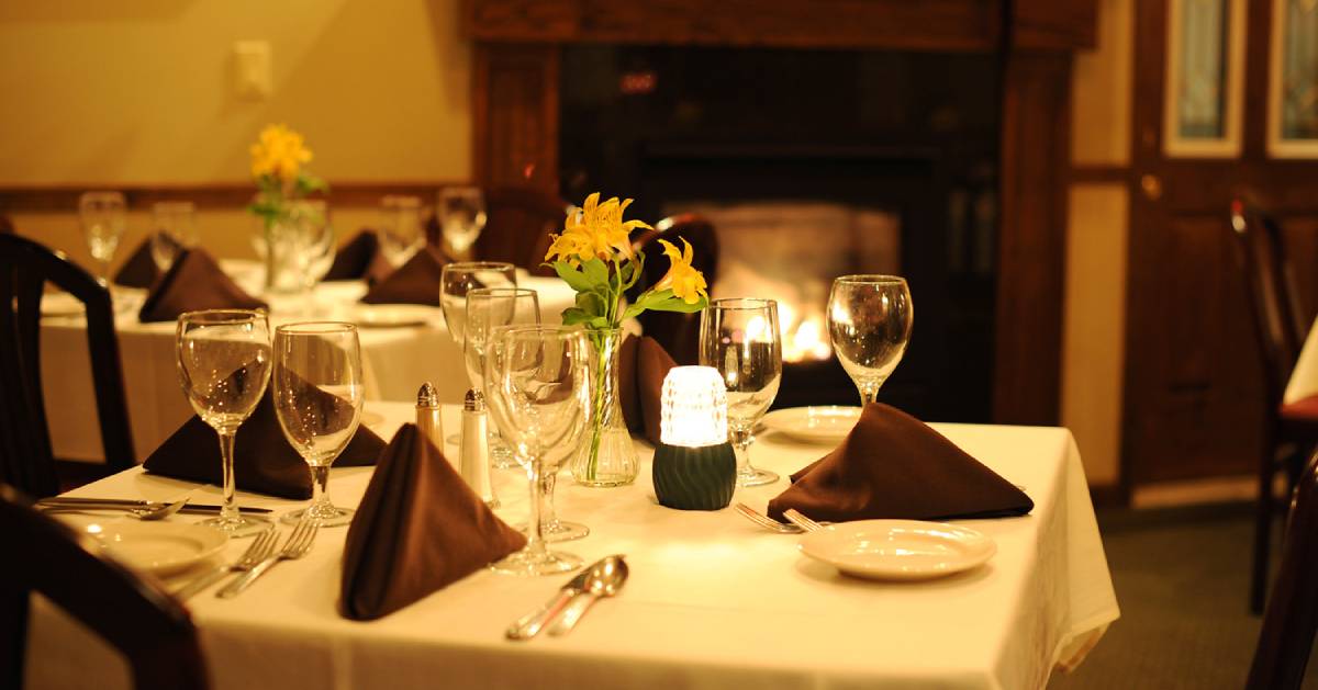 tableware on tables in a dining room