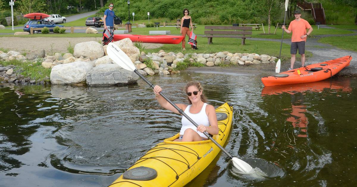 people kayaking from a shoreline