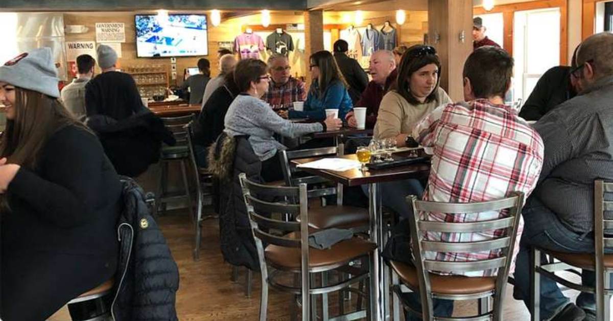 people chilling and eating at a brewpub