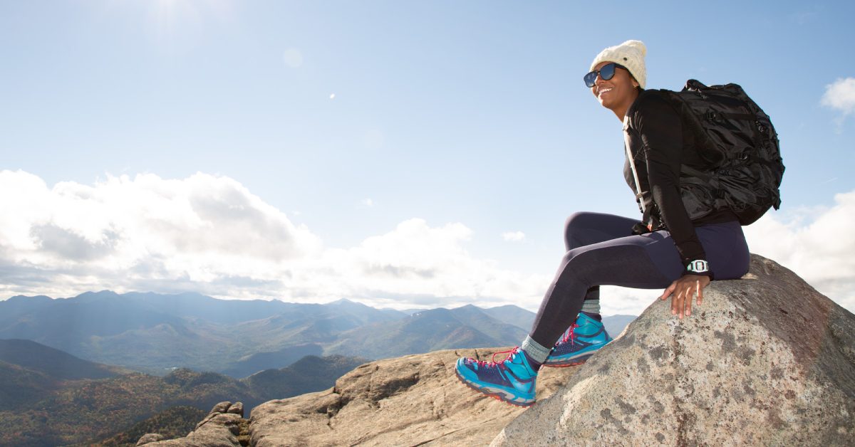 person atop a mountain in fall