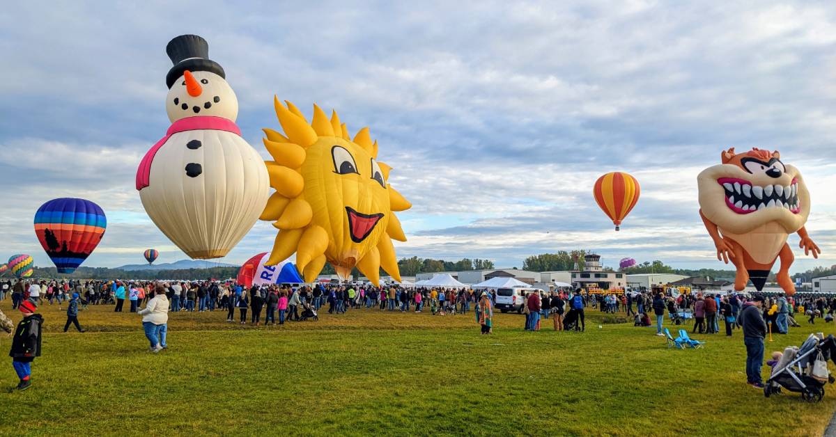 balloon festival scene with snowman, sun, and Tasmanian devil balloons