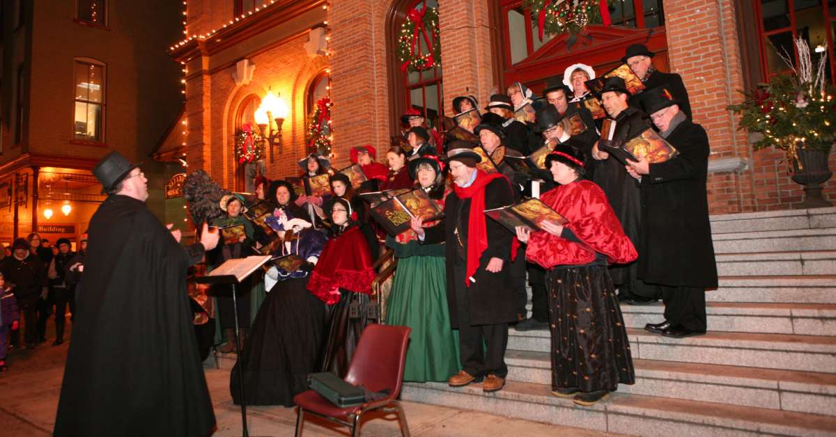 group of carolers on steps