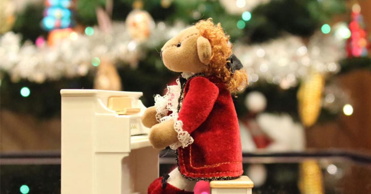 stuffed holiday ornament at a piano