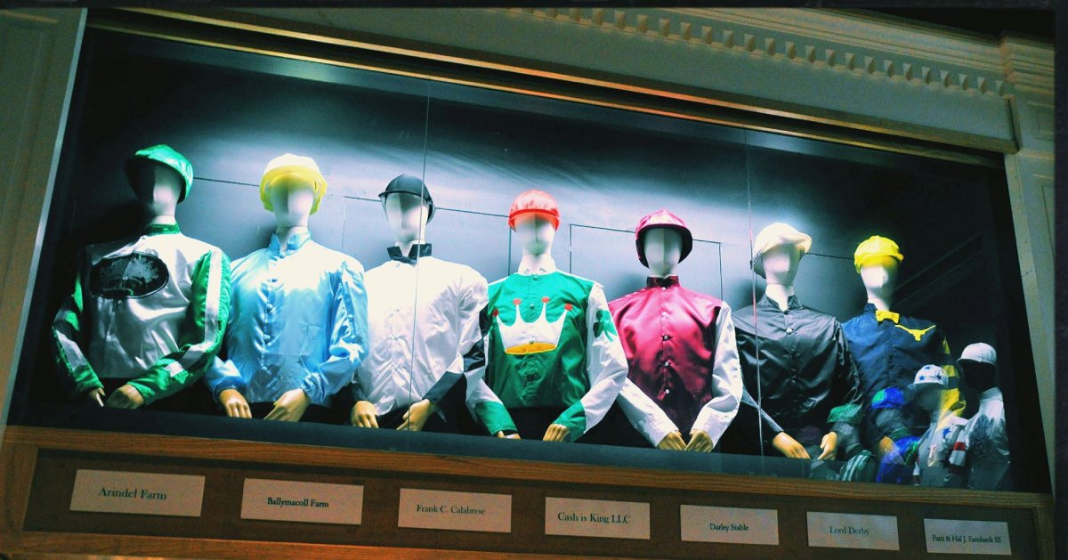 jockey uniforms on display in a museum