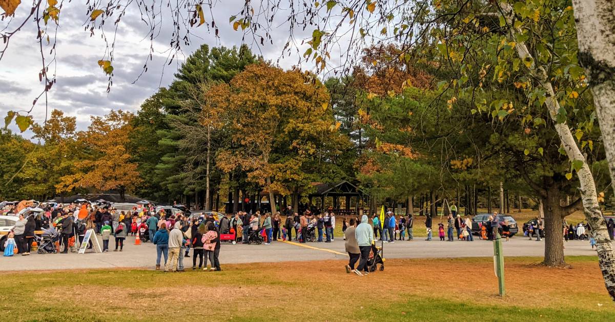 crowd of people at trunk or treat event