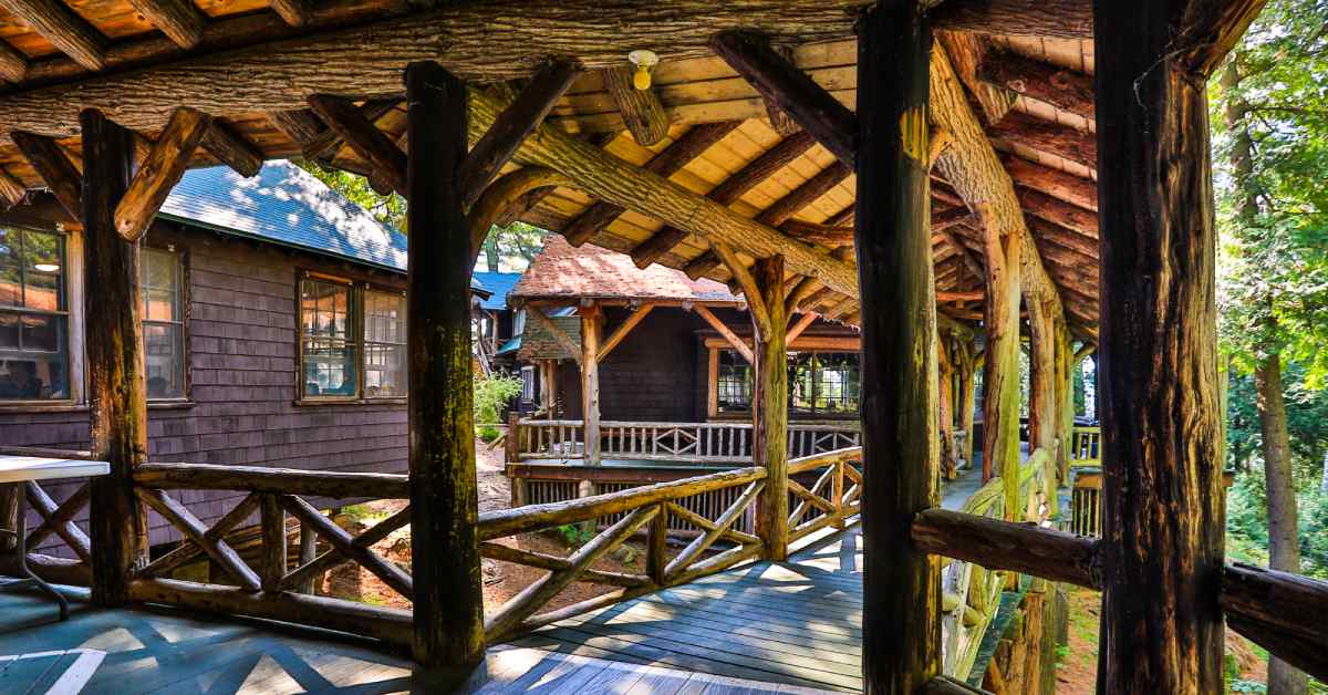 a traditional adirondack log building walkway in the sunshine