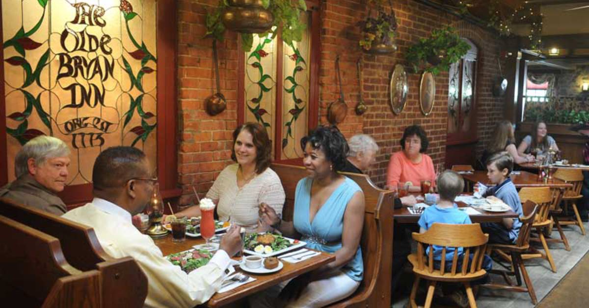 people eating in a dining room