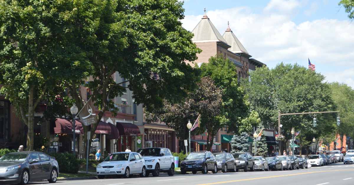 cars parked along the side of a city street