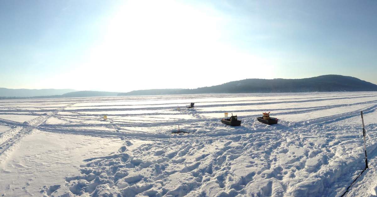 Ice Fishing Rod On Frozen Lake Covered With Snow Stock Photo