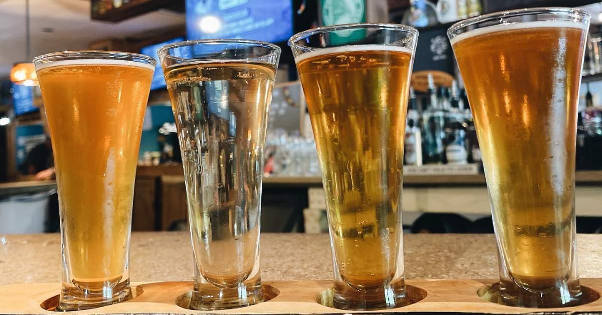 a flight of beers on a bar