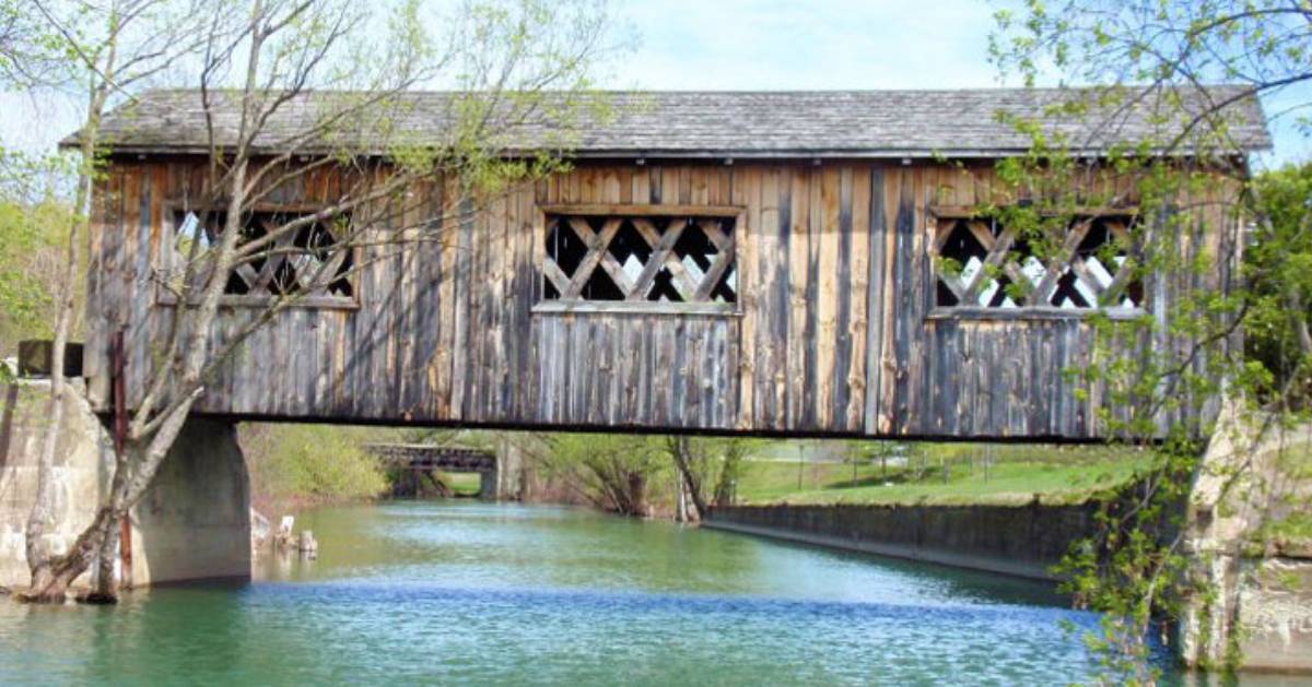 a covered bridge over water