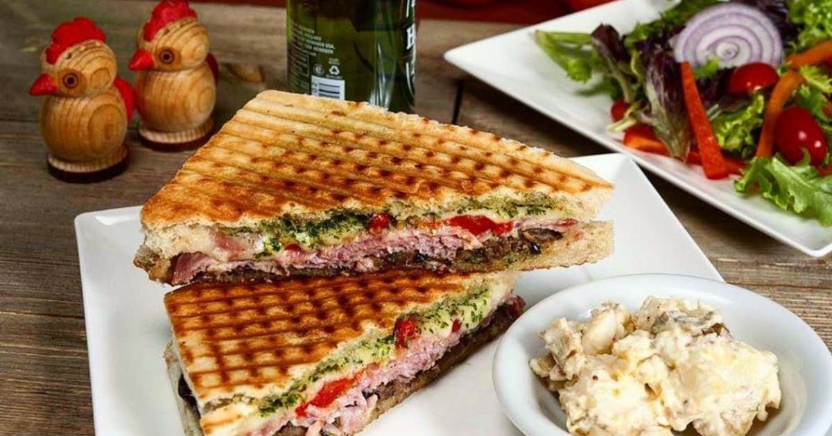 two halves of a panini on a plate