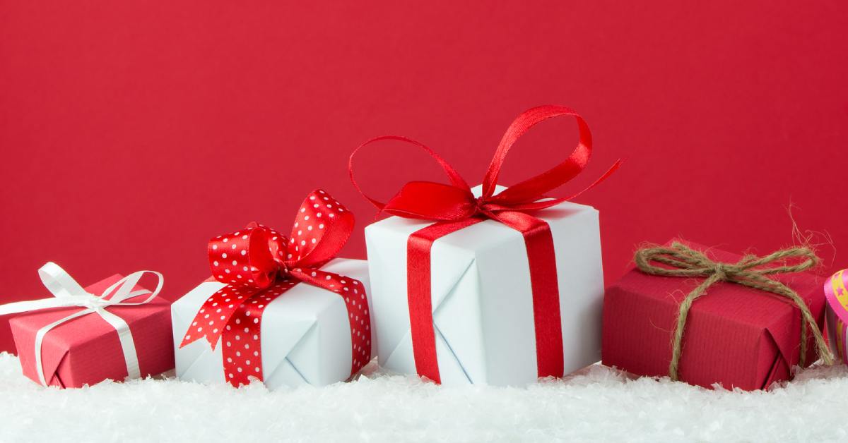 image of holiday gifts over red background