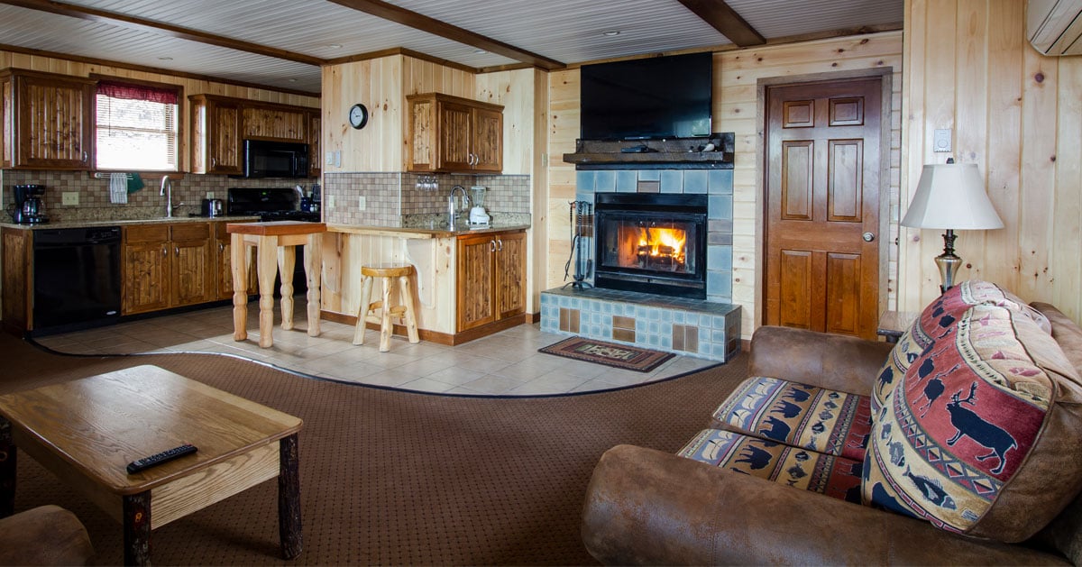 inside a nicely furnished cabin with fireplace