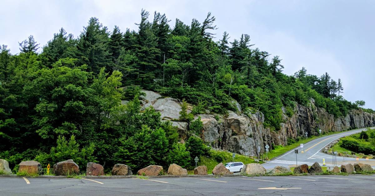 parking lot near a mountain summit and road