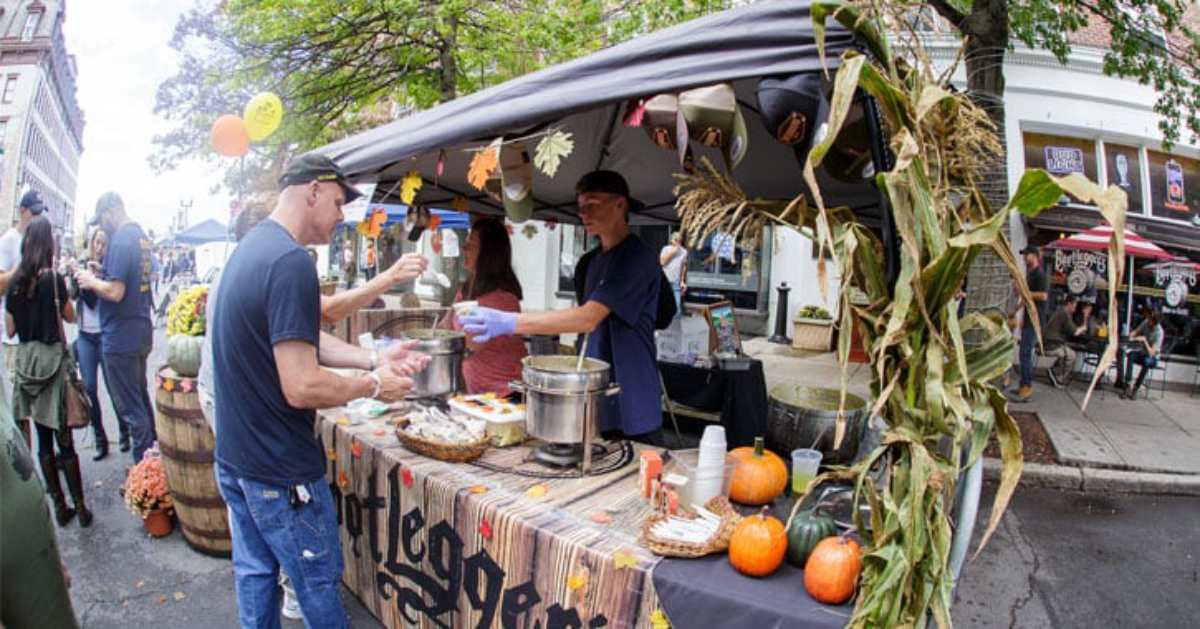 a man getting chowder for Bootlegger's booth