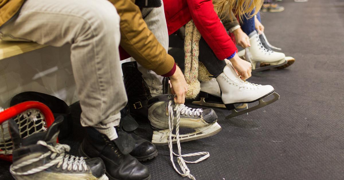 people lacing up ice skates