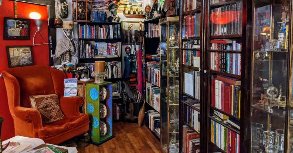 a cozy bookstore with eclectic decor and a wood floor