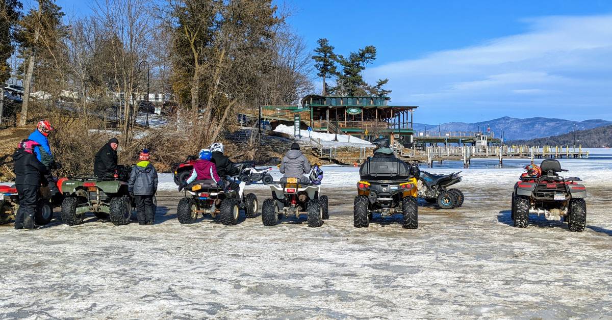 atvs lined up on the ice