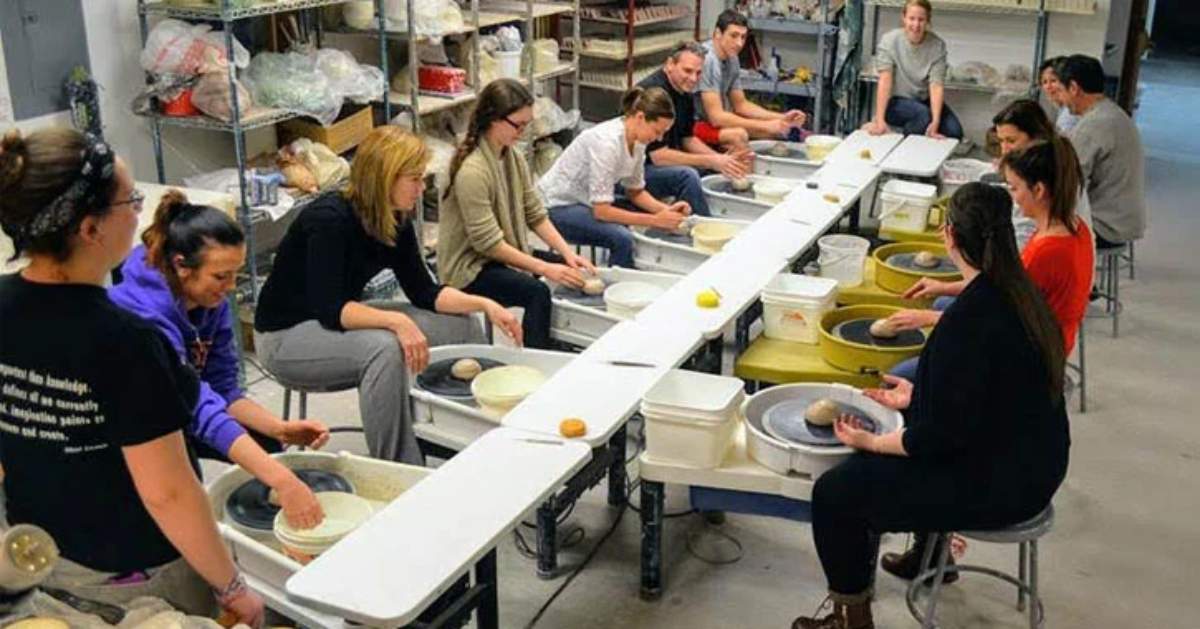 group of people working with clay