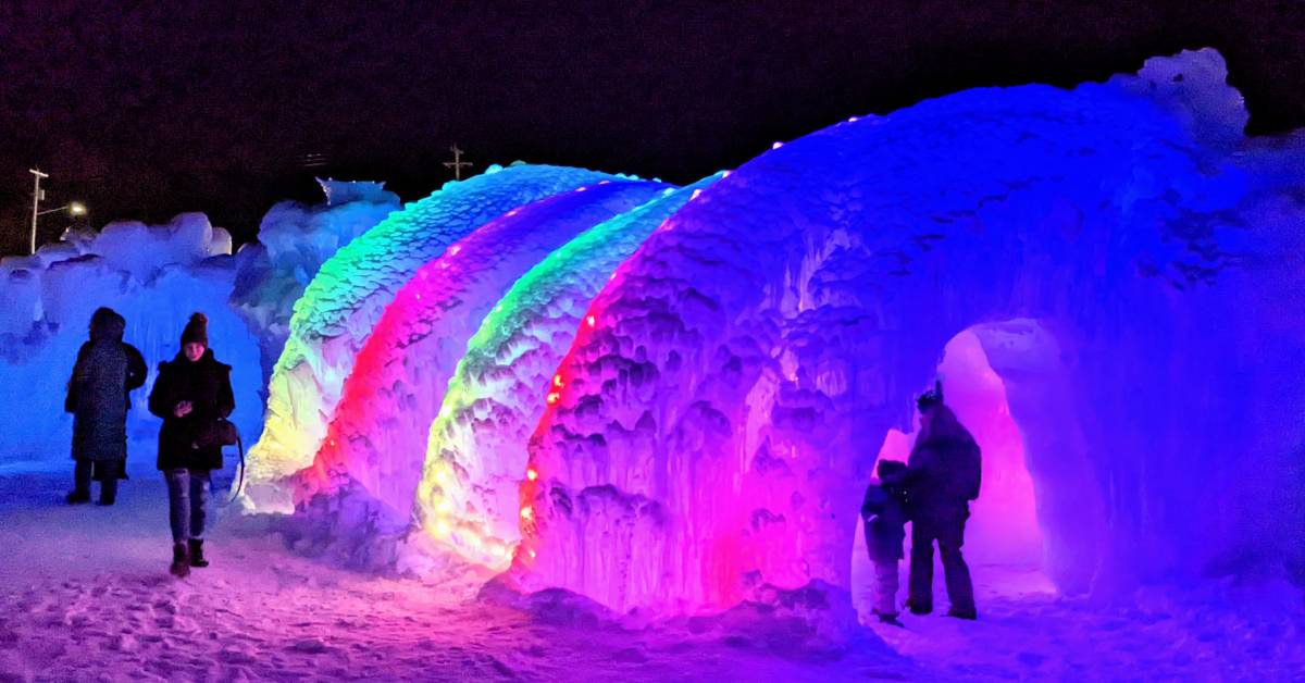 ice castles attraction at night with purple and blue lights