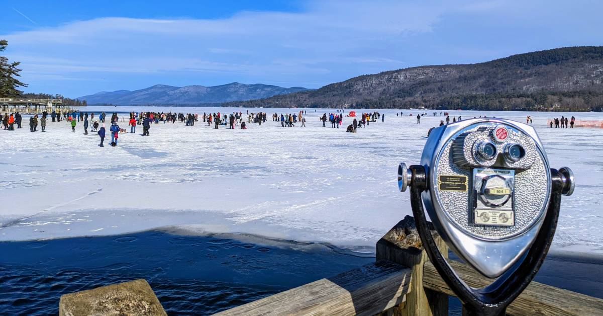 crowd of people on ice on lake