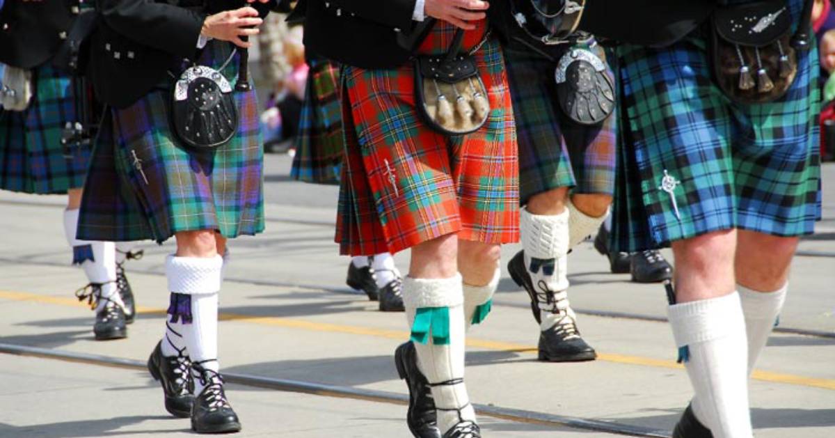 bagpipers marching in a street parade