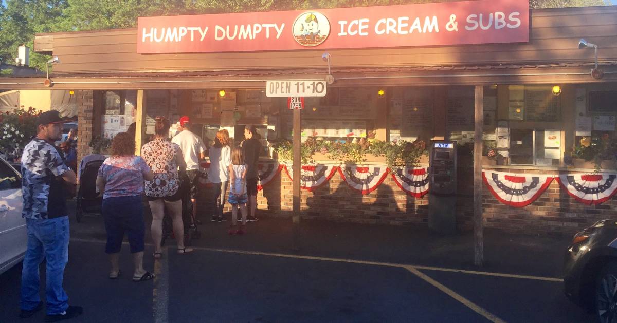 people in line at ice cream shop