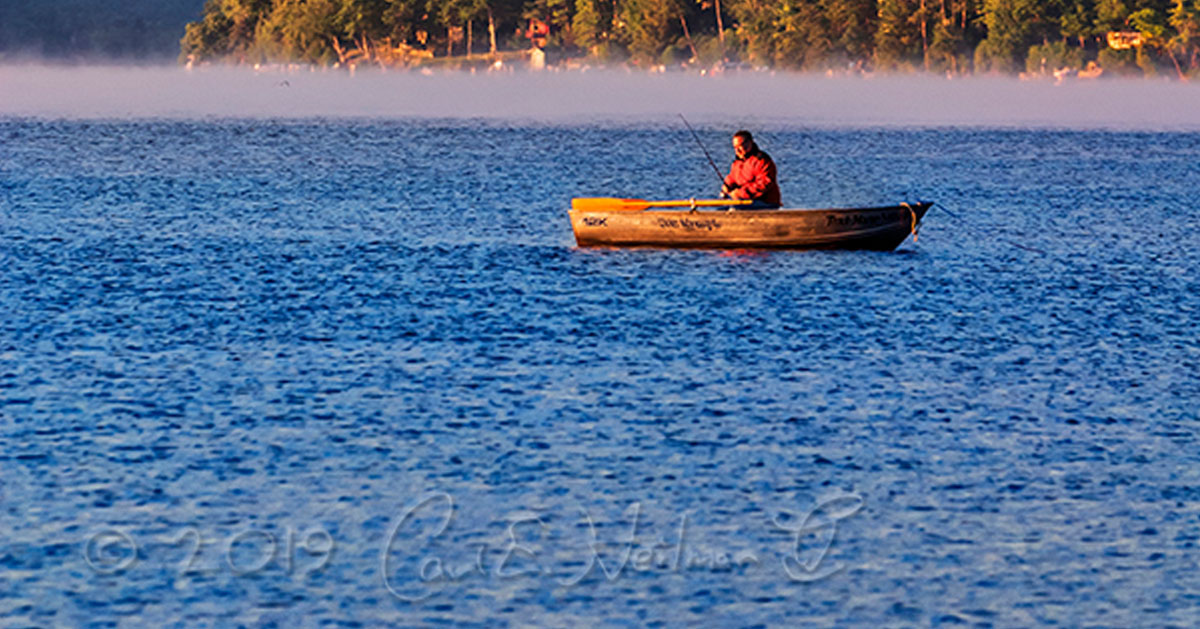 man on boat in water