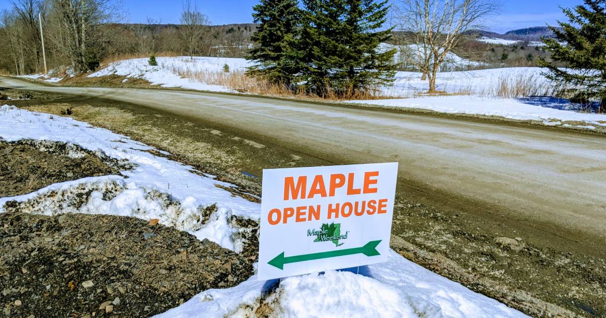 a sign for a maple open house