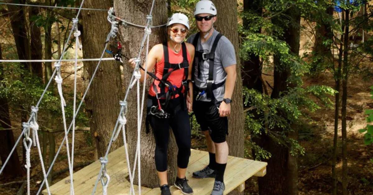 couple in treetop course