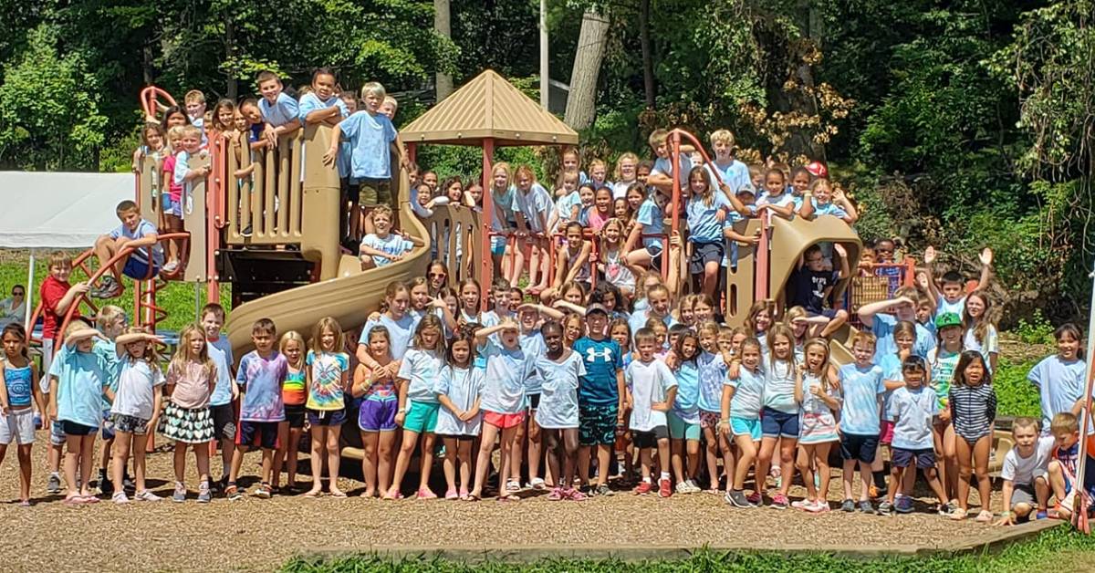 group photo of kids on a playground