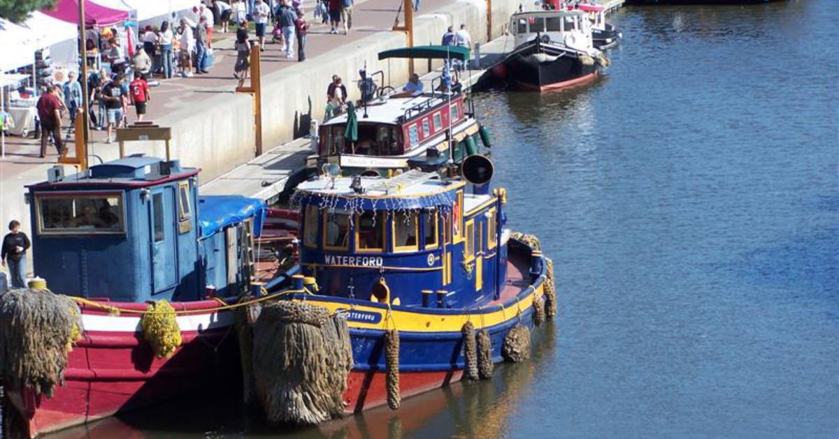 canal boats near shore at festival