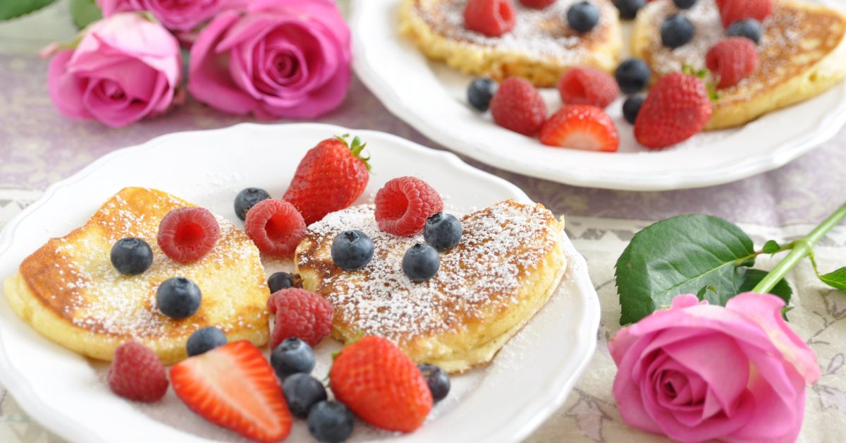 pancakes, berries, and pink roses